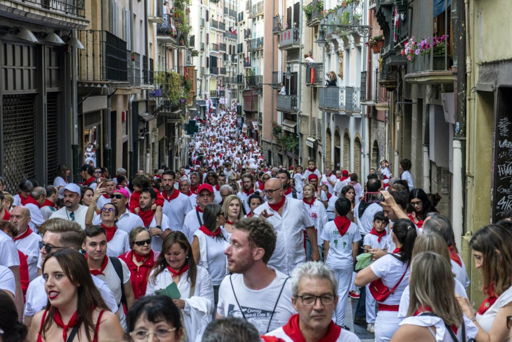Visitors walking through Pamplona during the festival