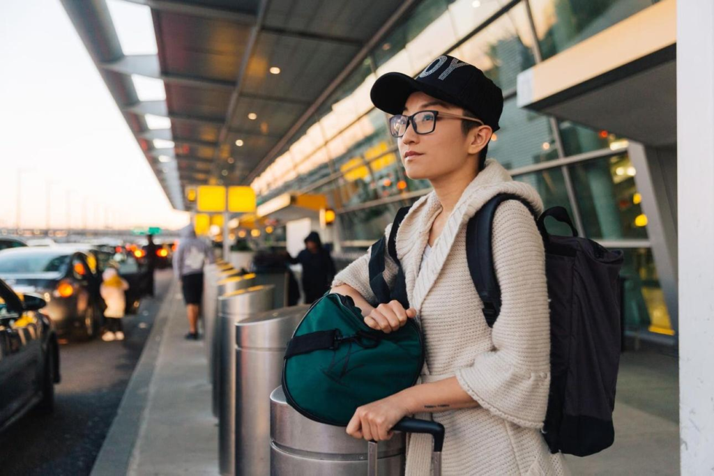 Traveler waiting for transportation outside a European airport