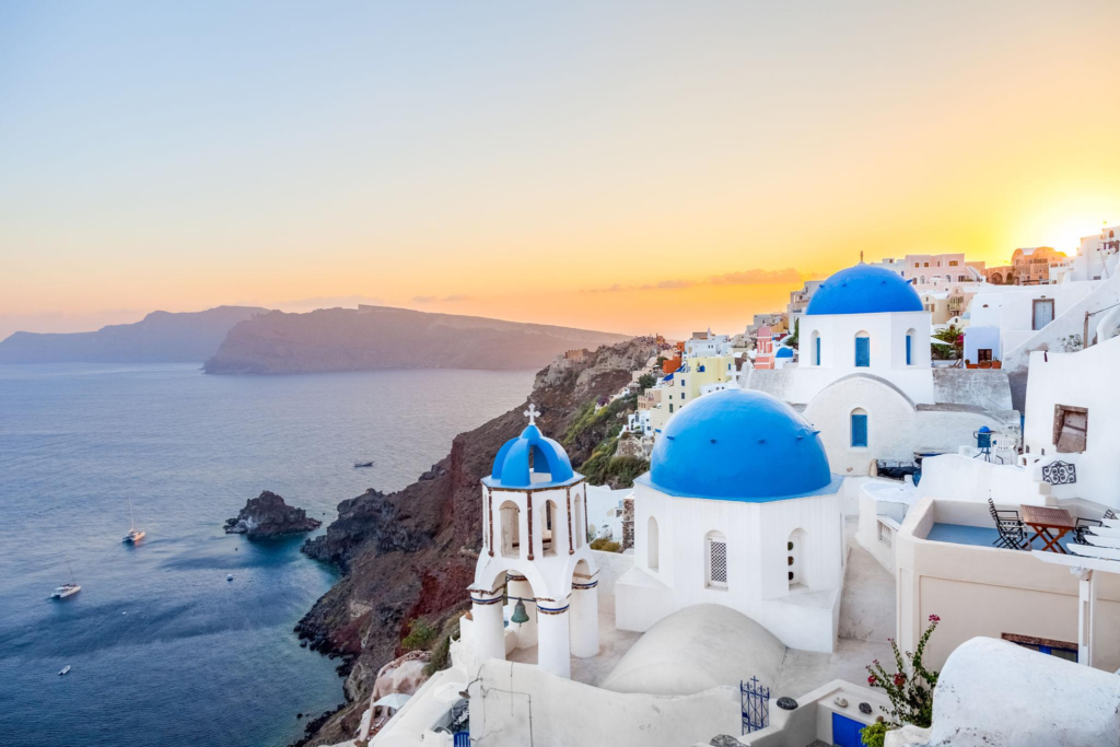 Santorini Greece blue domes at sunset