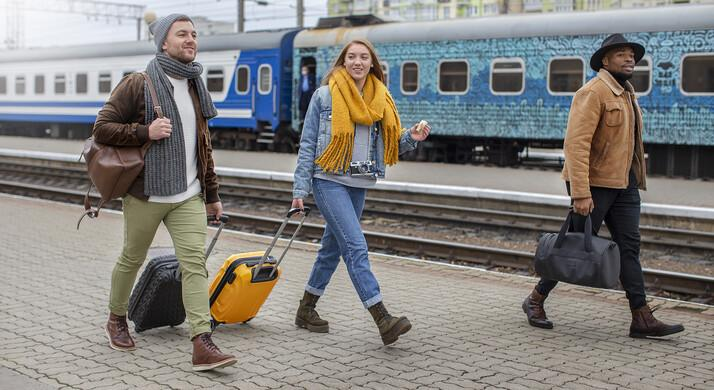 Travelers planning transportation between European festivals