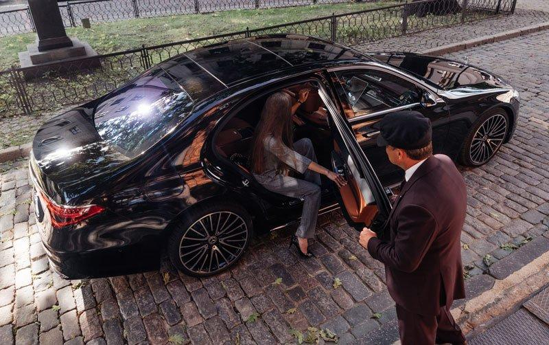 Business traveler using chauffeur service